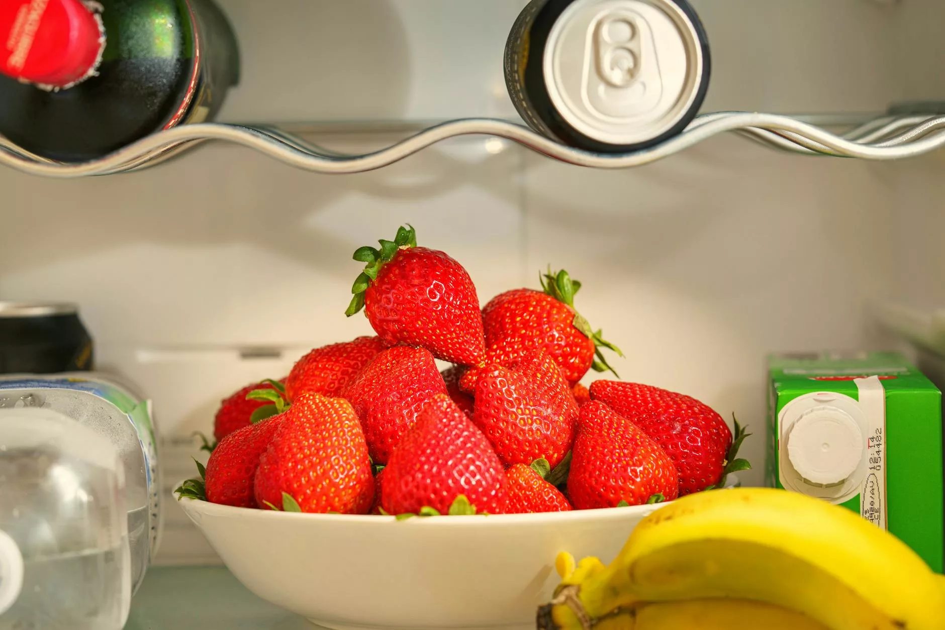 close up shot of fresh strawberries on ceramic bowl